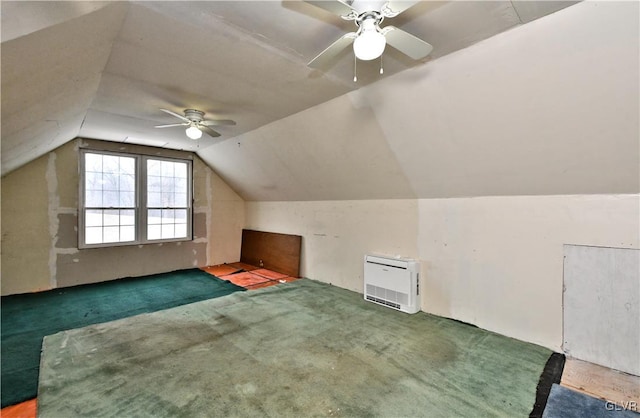 bonus room featuring ceiling fan, lofted ceiling, carpet floors, and heating unit