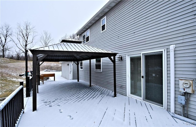 snow covered deck featuring a gazebo