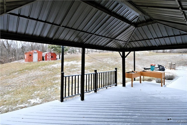 view of dock featuring a deck and a gazebo