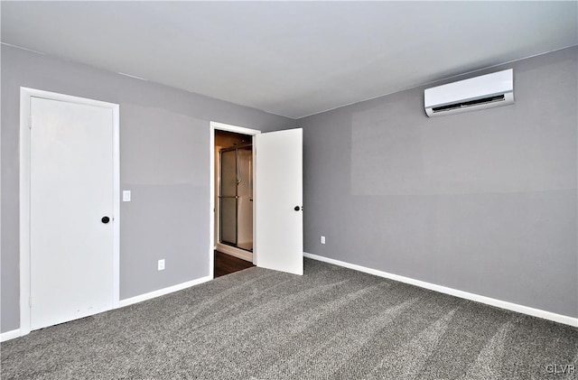 empty room with dark carpet and a wall mounted AC