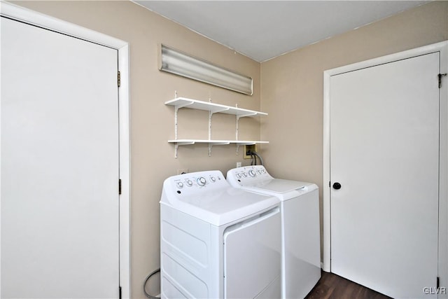 laundry room featuring dark wood-type flooring and independent washer and dryer