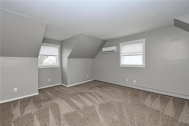 bonus room featuring a wall unit AC, a baseboard heating unit, a healthy amount of sunlight, and carpet flooring