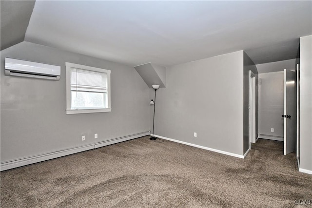 bonus room with baseboard heating, a wall mounted AC, and dark carpet