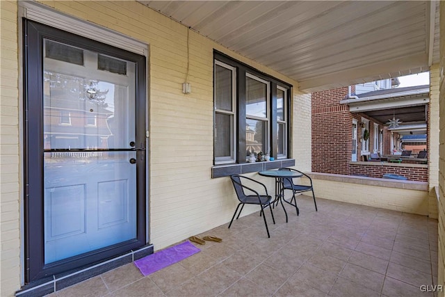 view of exterior entry featuring a porch