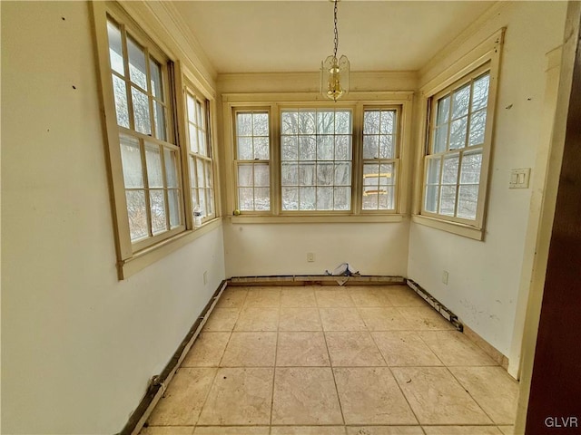 unfurnished sunroom featuring a notable chandelier