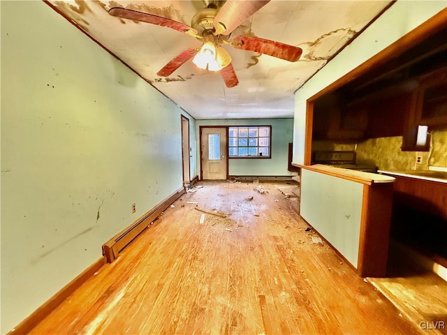 interior space featuring a baseboard heating unit, light wood-type flooring, and ceiling fan