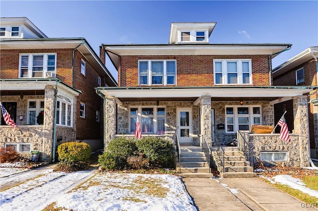 multi unit property featuring a porch