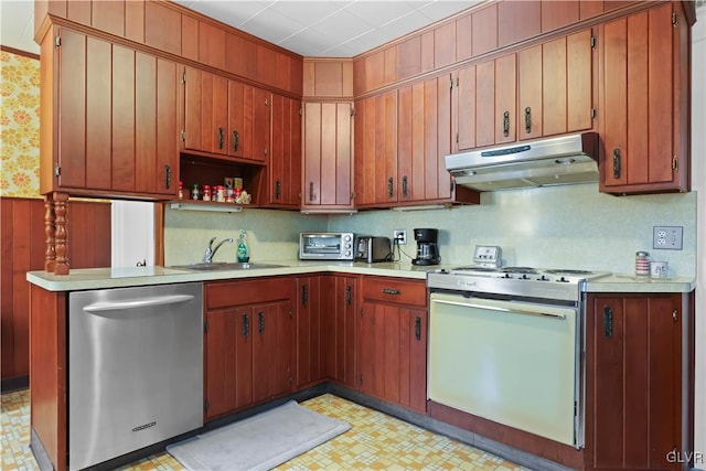 kitchen with stainless steel dishwasher, sink, and gas range