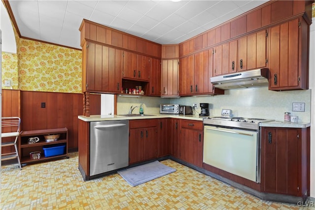 kitchen with range with gas cooktop, stainless steel dishwasher, ornamental molding, and sink