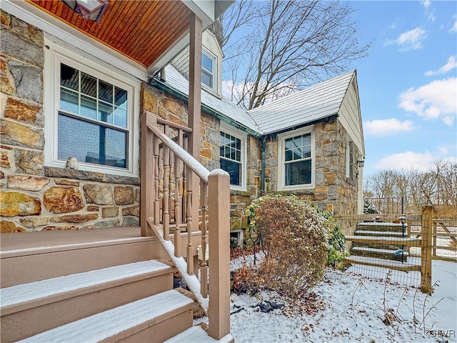 view of snow covered property entrance