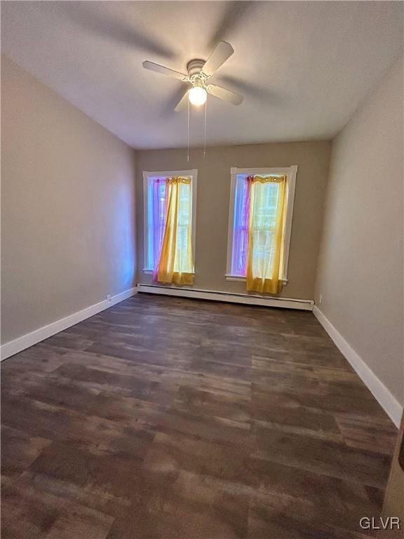 spare room with a baseboard heating unit and ceiling fan