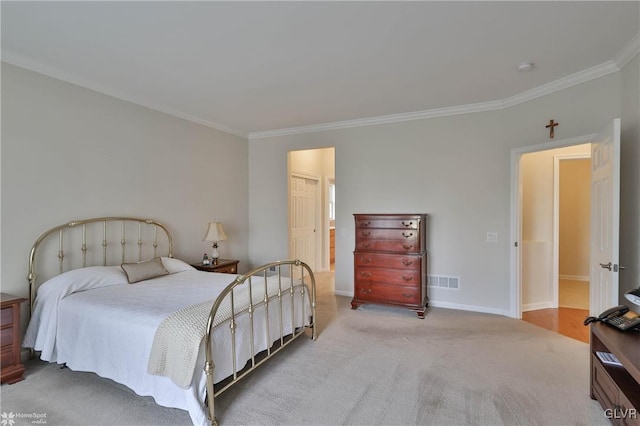 carpeted bedroom with ornamental molding