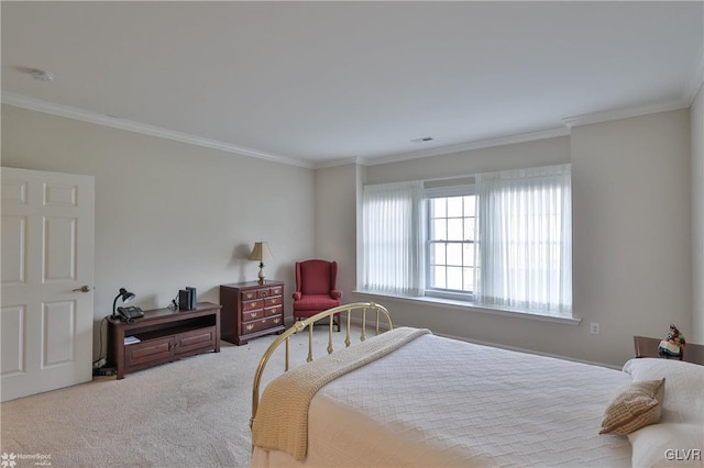 carpeted bedroom with ornamental molding