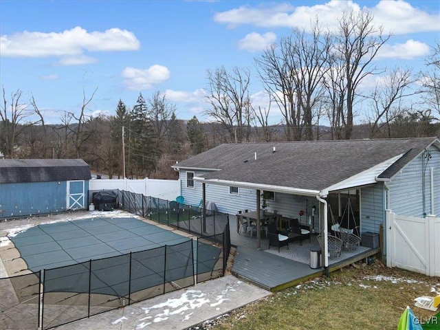 view of pool with a storage shed