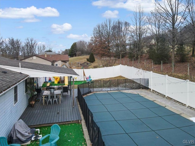 view of swimming pool featuring a wooden deck