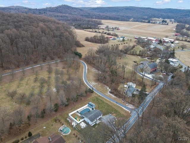 birds eye view of property with a rural view