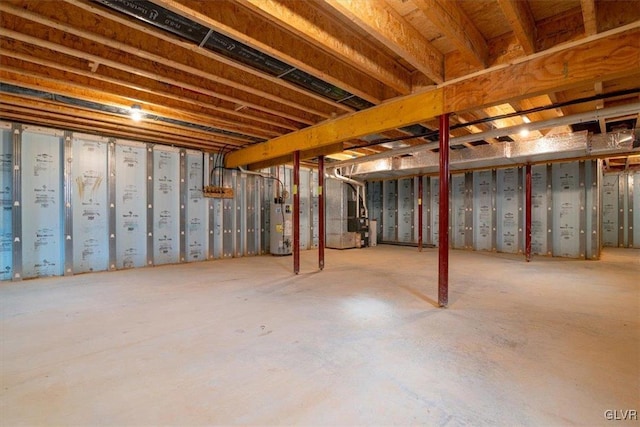 basement with water heater and heating unit