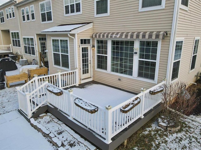 view of snow covered deck