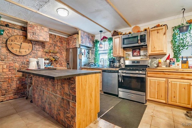 kitchen featuring stainless steel appliances, brick wall, light tile patterned floors, a breakfast bar area, and ornamental molding