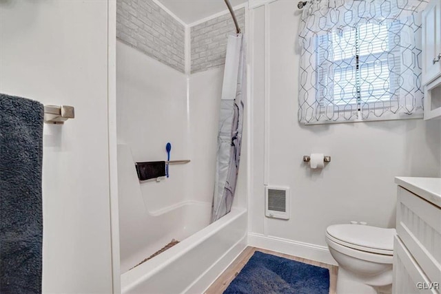 full bathroom with toilet, vanity, hardwood / wood-style floors, and shower / bath combo with shower curtain