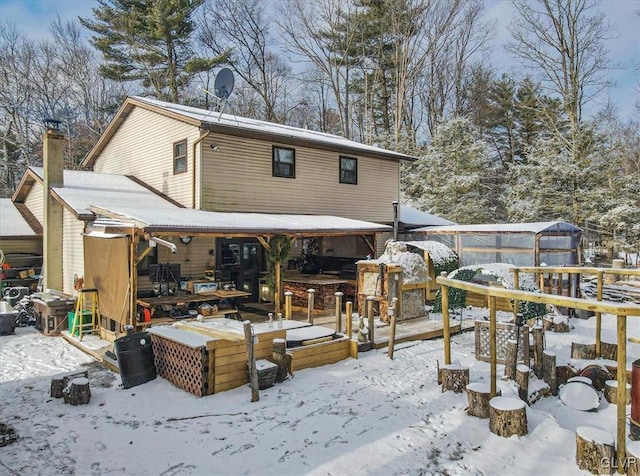 view of snow covered house