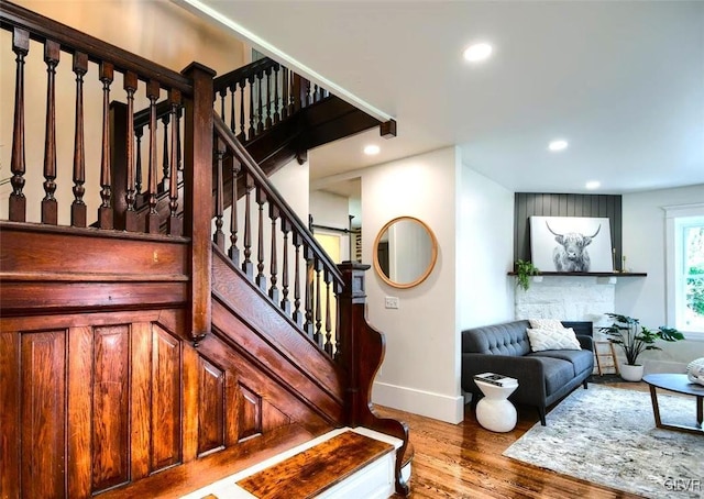 staircase with hardwood / wood-style flooring