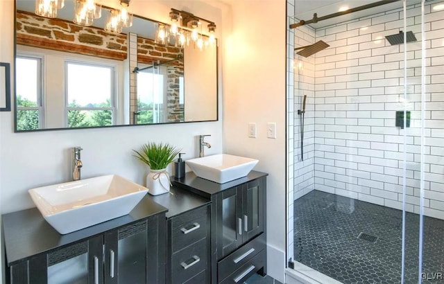 bathroom featuring vanity and a shower with shower door