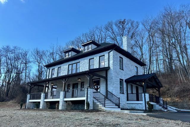1265 W Baltimore Pike, New Garden Township, PA 19374 - view of front facade with stairway, covered porch, and a chimney