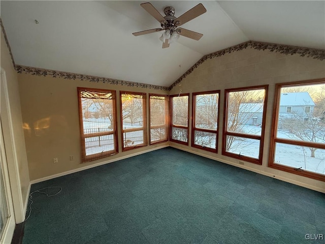 interior space with ceiling fan and vaulted ceiling