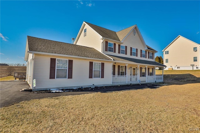 view of front of home featuring a porch and a front yard