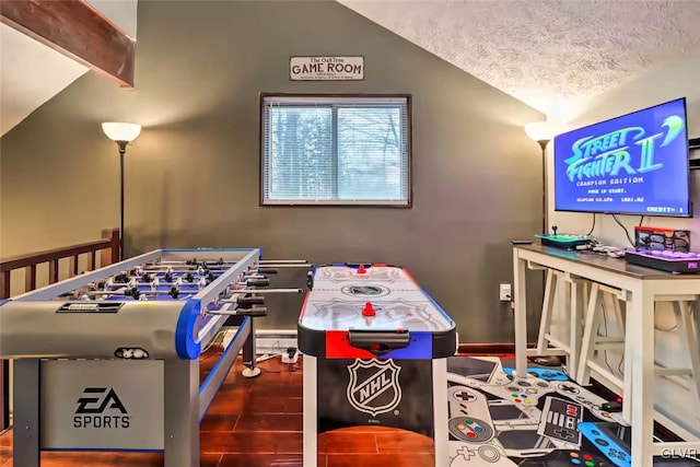 game room with hardwood / wood-style flooring and a textured ceiling