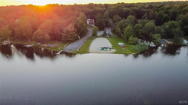 aerial view at dusk with a water view