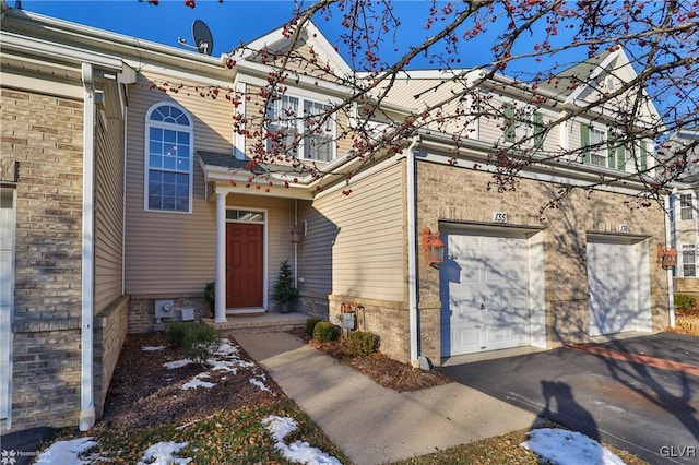 view of exterior entry featuring a garage