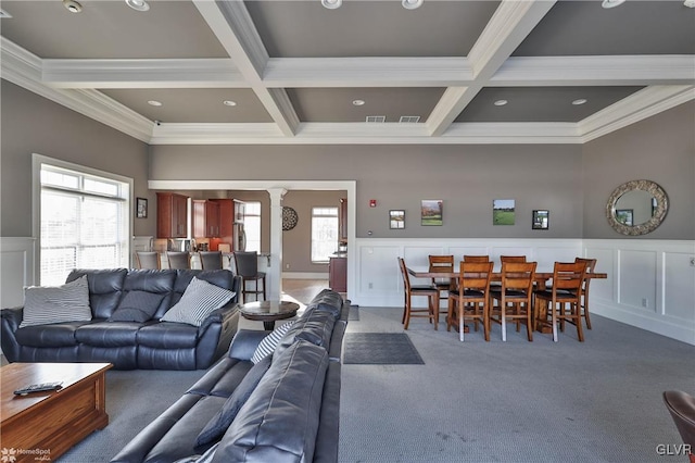 carpeted living room with beamed ceiling, crown molding, and coffered ceiling