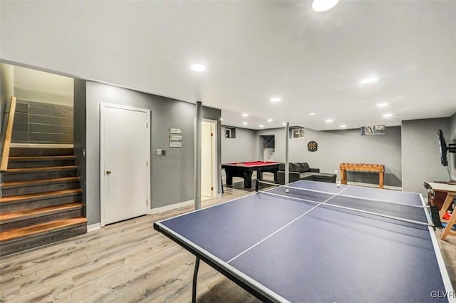 game room with billiards and light hardwood / wood-style flooring