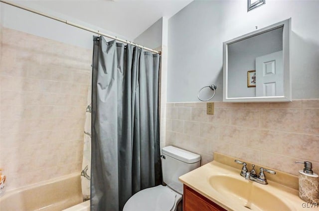 full bathroom featuring tile walls, toilet, shower / tub combo with curtain, and vanity