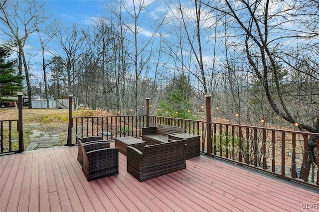 wooden terrace featuring an outdoor living space