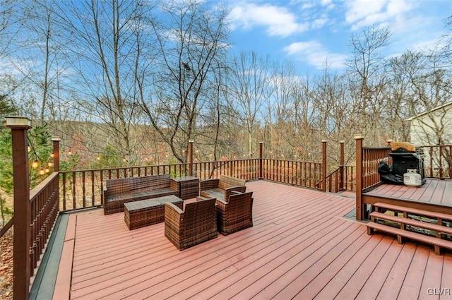 wooden terrace with an outdoor hangout area