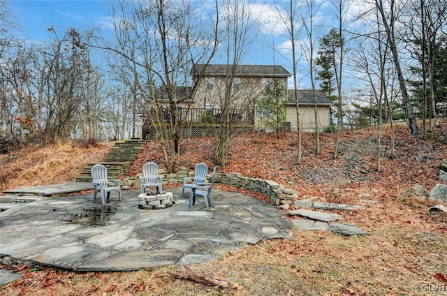 view of yard with a patio and an outdoor fire pit