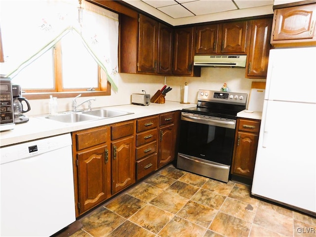 kitchen with white appliances and sink