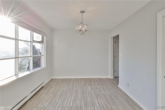 empty room with a chandelier and a baseboard heating unit