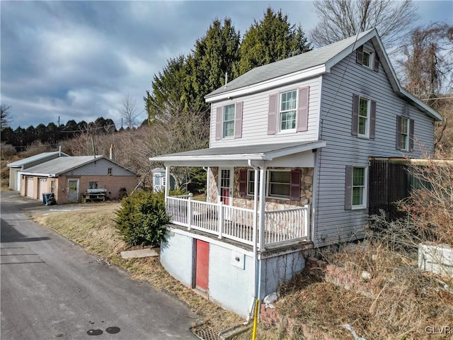 front of property featuring a garage and a porch