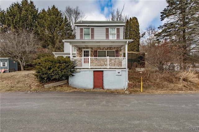 view of front property featuring covered porch