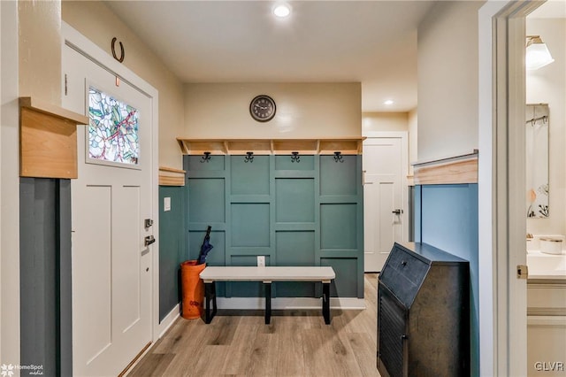 mudroom with light hardwood / wood-style flooring