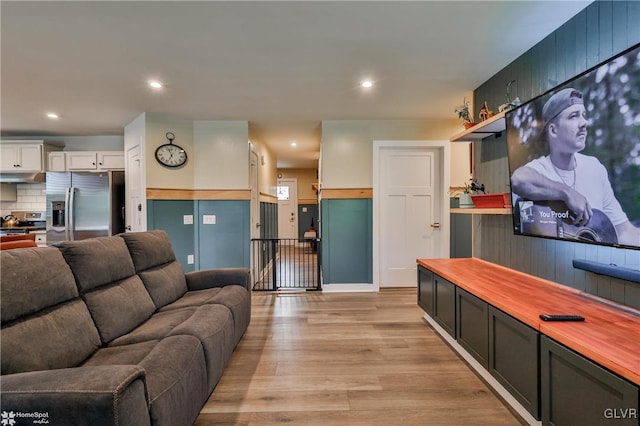 living room with light hardwood / wood-style flooring