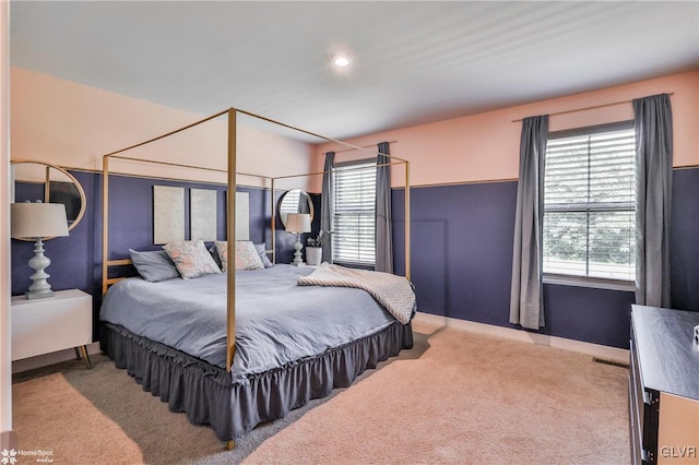 bedroom with light colored carpet