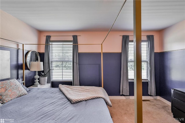 bedroom featuring light colored carpet