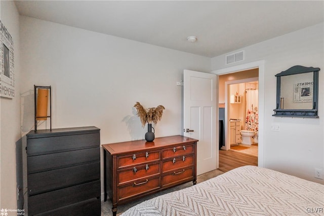 bedroom featuring connected bathroom