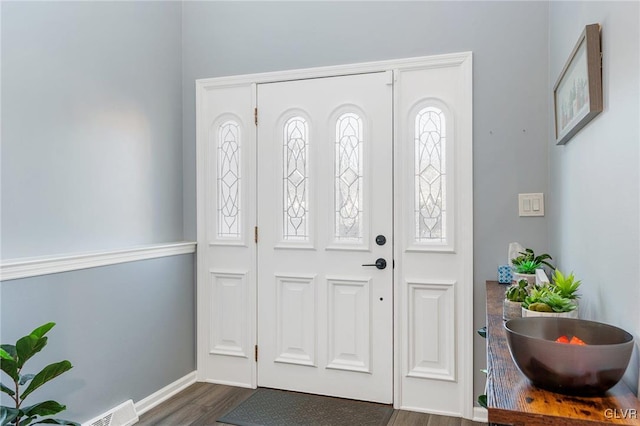 entryway with dark wood-type flooring