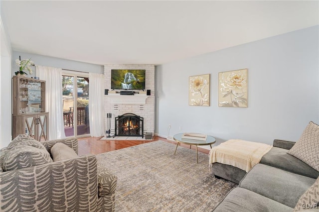 living room featuring a fireplace and hardwood / wood-style floors